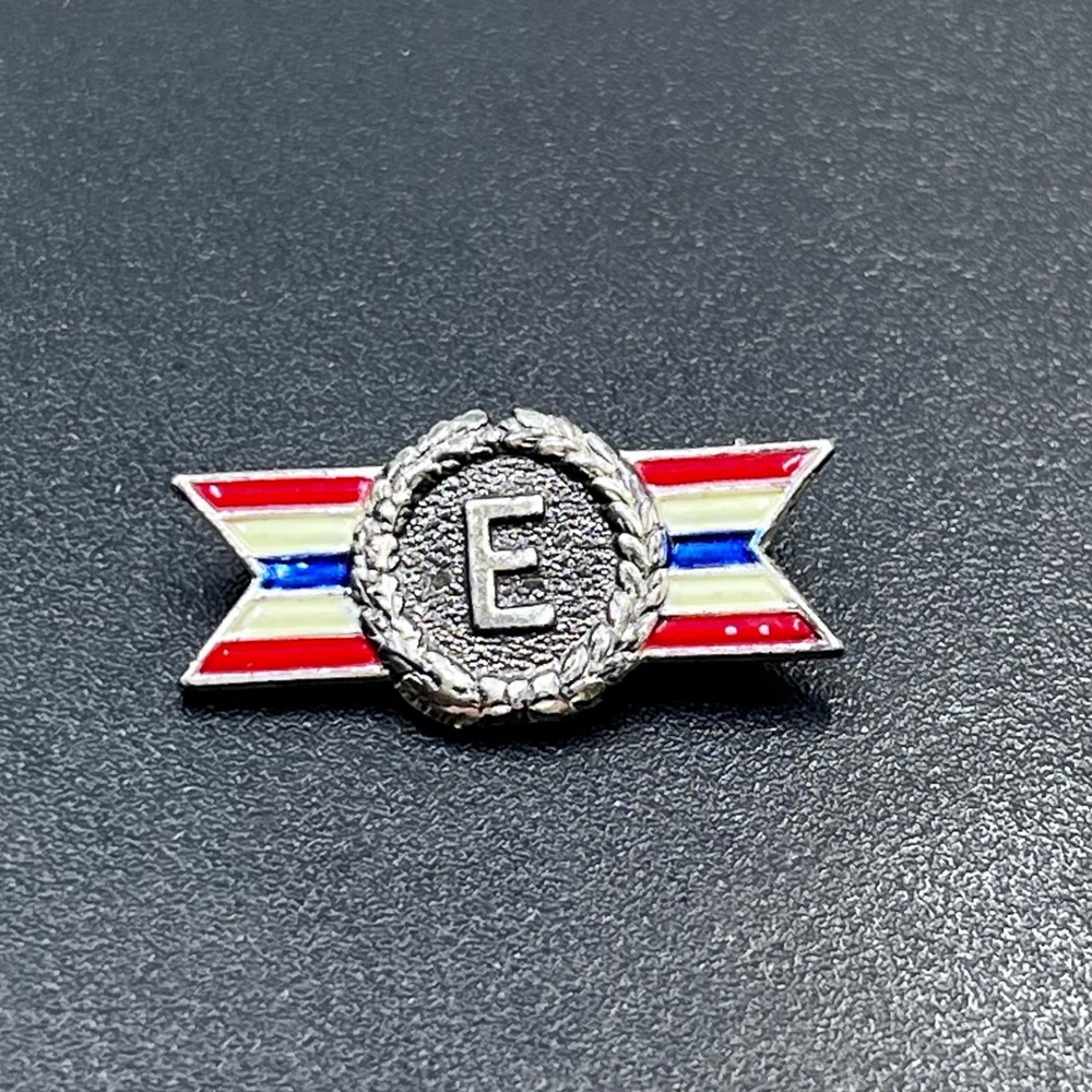 WWII Army-Navy "E" Production Excellence Award pin is Design Patent 134959 Coro